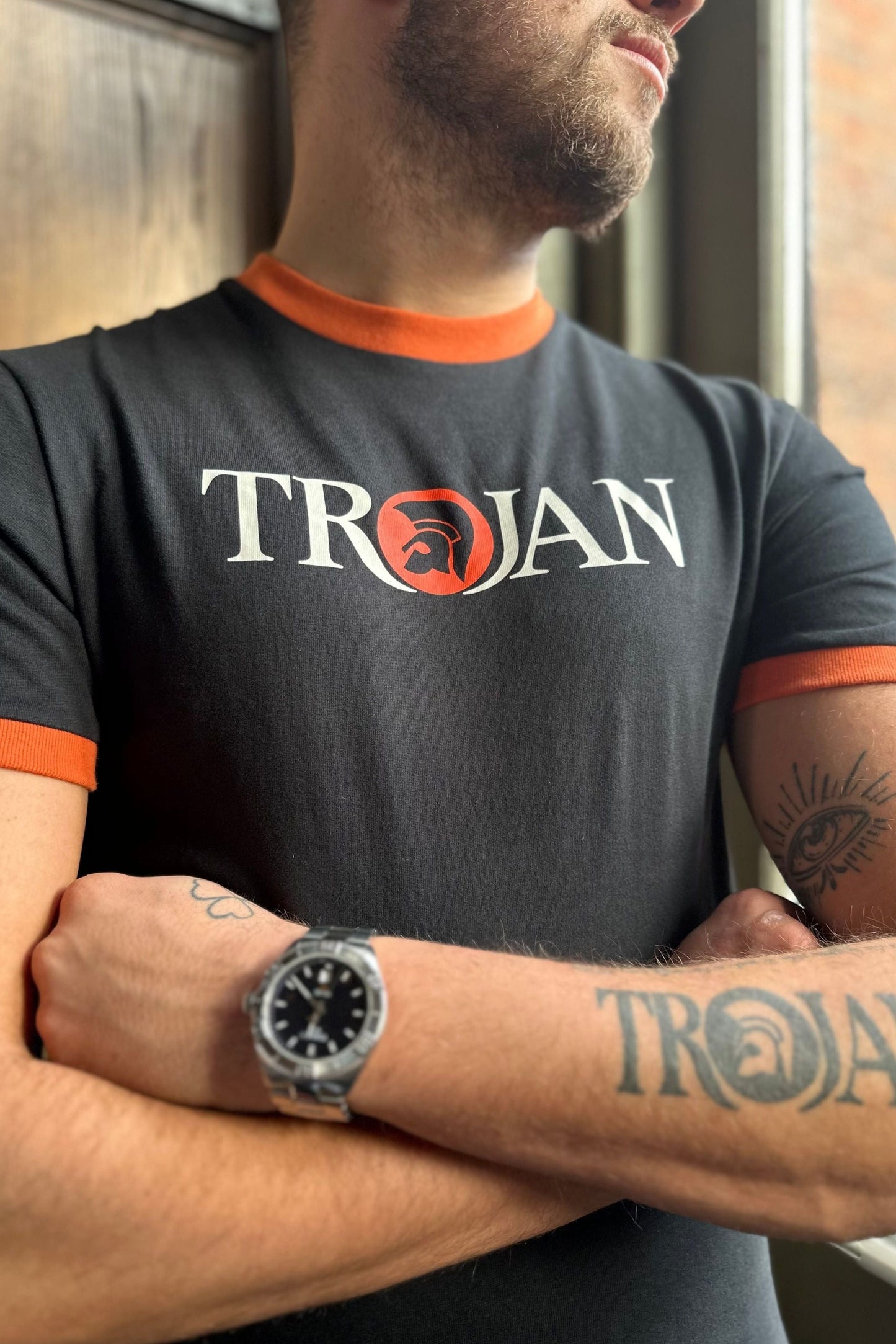 TC/1014 Black & Orange Logo Ringer - T-Shirt